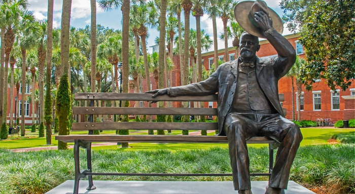 Statue of John B. Stetson sitting on a bench